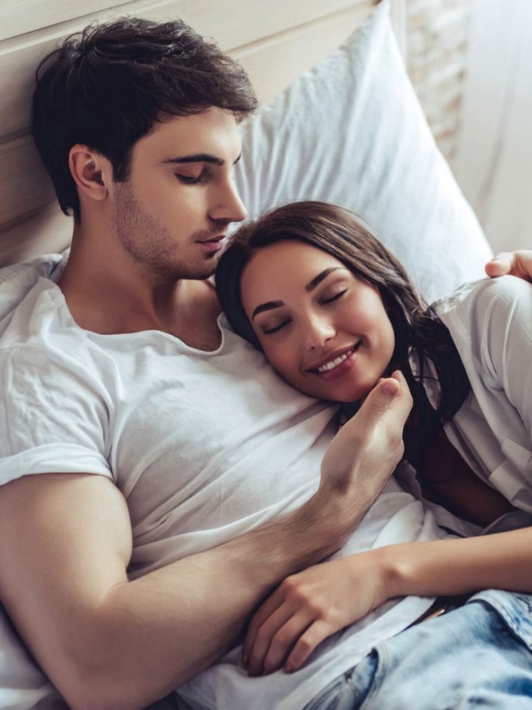 Couple chills in bed after an affair