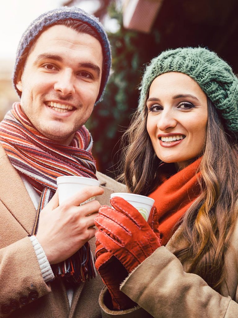 Couple has a sensual date at the Christmas market